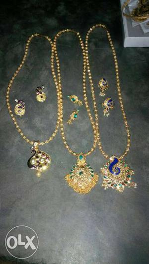 Three Pairs Of Gold Earrings And Necklacesmol