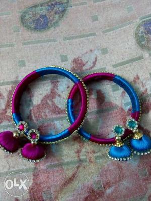 Two Blue-and-red Silk Thread Bracelets With Pair Of Jumkha