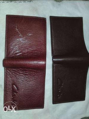 Two Leather Bi-fold Wallets