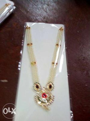 Gold Beaded Necklace In Pack
