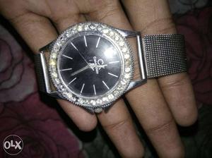 It is a diamond watch made by calvin klen.
