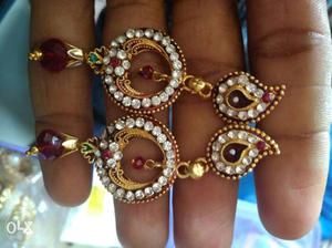Pair Of Gold With Diamond And Red Gemstone Drop Earrings