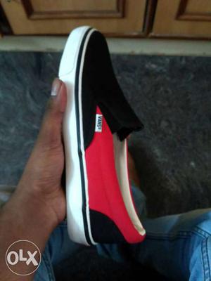 Paired Red,black, And Whtie Vans Sneaker
