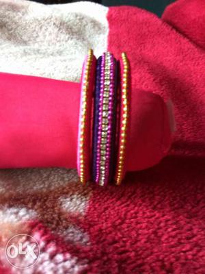 Red, Purple, And Yellow Threaded Bangles