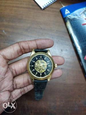 Round Gold And Black Skeleton Watch