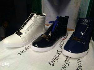Three Unpaired White And Black High Top Sneakers