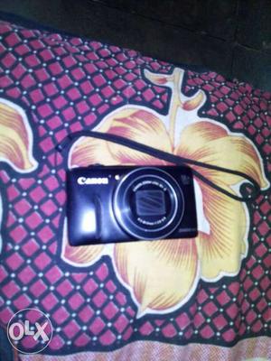 Black Canon Point-and-shoot Camera