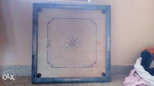 Carrom board with wooden coins for sale only two