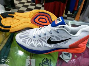 Pair Of White-orange-and-blue Nike Basketball Shoes