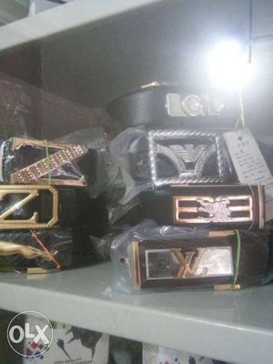 Seven Black Leather Belts