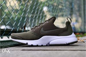 Unpaired Brown And White Nike Walking Shoe