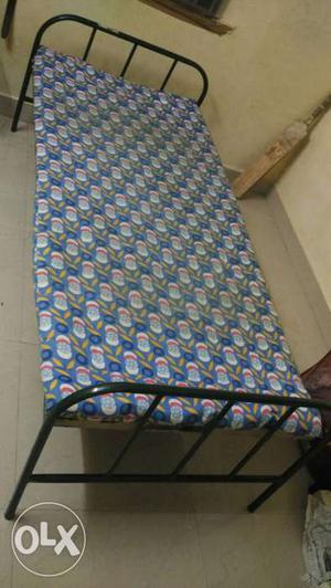 A metal bed which is good in condition with