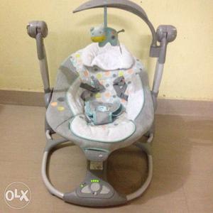 Baby's White And Gray Cradle And Swing