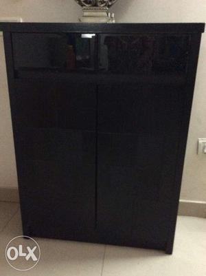 Black Color shoe rack, has 2 drawers and lot of