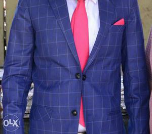 Blue Grid Suit Jacket And Red Necktie
