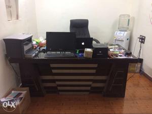 Brown Wooden Office Desk; Black Flat Screen Computer Monitor
