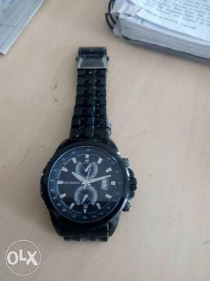Curren black steel strap watch date display