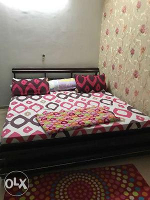Dark wood colour queen bed for sale in sector 66,