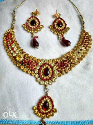 Diamond Embellished And Ruby Gold Chandelier Necklace With