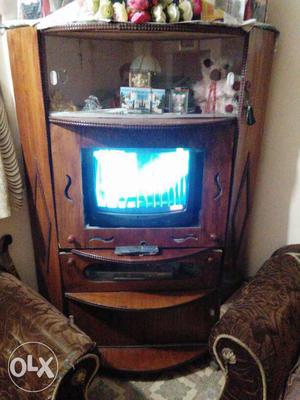 Grey CRT TV; Brown Wooden TV Hutch