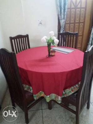 One round wood table with 4 chairs in very good