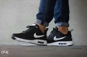 Pair Of Black And White Nike Air Max Shoes