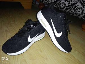 Pair Of Black-and-white Nike Sneakers