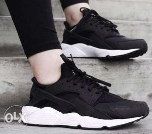 Pair Of Black-and-white Reebok Sneakers