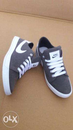 Pair Of Gray Nike Plimsolls, size 6-10 available