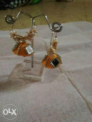 Pair Of Orange Jhumka Earrings