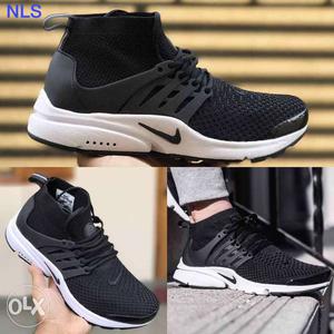Paired Black Nike Running Shoe