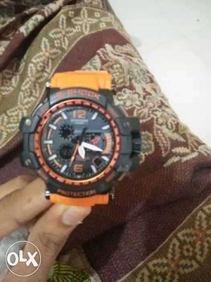 Round Black And Orange G-shock Digital Watch