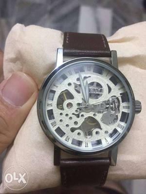 Round Silver Skeleton Watch With Brown Leather Strap