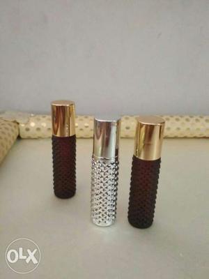 Silver And Red Perfume Bottles