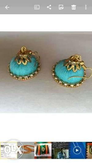 Two Gold-and-green Jhumka Earrings