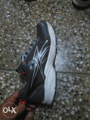Unpaired Of Black And White Running Shoes