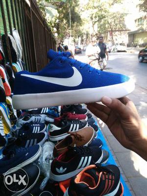 Unpaired White And Blue Nike Low-top Sneaker