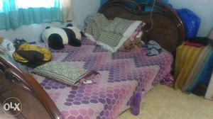 Brown Wooden Bed Frame With Purple Blanket And Pillow; Panda