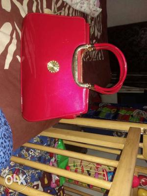 Hot red colour handbag new and unused