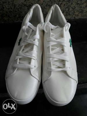 Pair Of White Lacoste Low Top Sneakers
