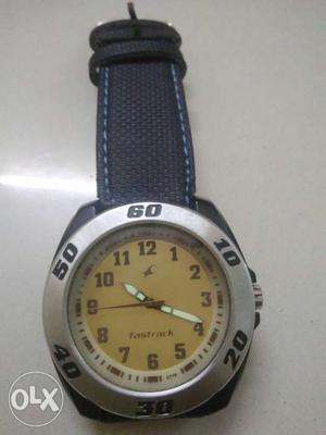 Round Silver Fastrack Watch With Brown Leather Strap