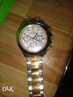 Round White Chronograph Watch With Silver And Gold Chain
