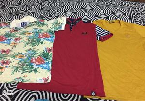 Three Yellow, Red, And Green Floral Shirts