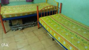 Two Quilted Yellow-and-orange Floral Mattresses along with