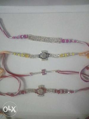 Two Red, One Yellow, And One Purple Rhinestone Inlay