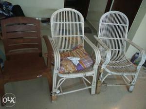 Two White Wicker Armchairs; Brown plastic Armchair
