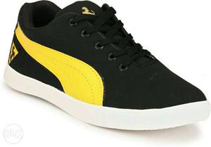 Unpaired Black And Yellow Low Top Sneaker