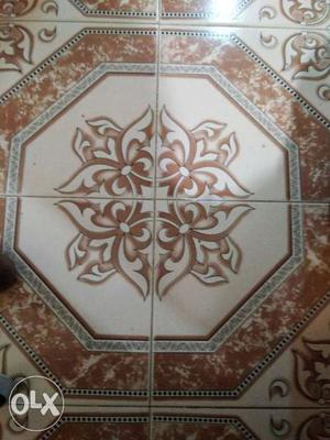 White, Brown, And Black Floor Tile