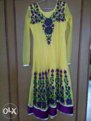 Yellow colour frock suit with purple and green
