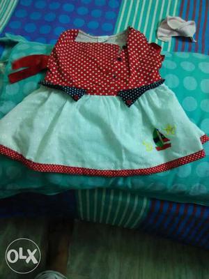 Almost new frock for sale..size 0-6 months